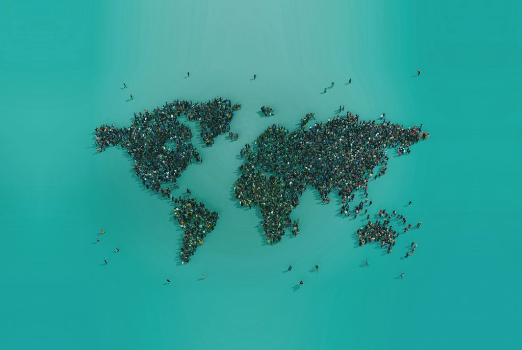 A world map drawn by a crowd of people seen from above