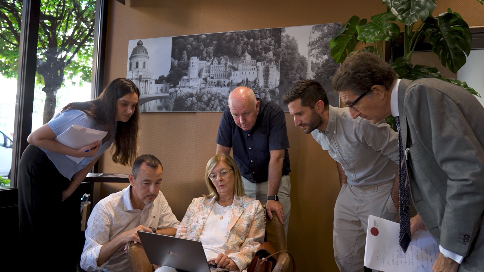 Members of the Amyloidosis Alliance gathered around a laptop during a working session